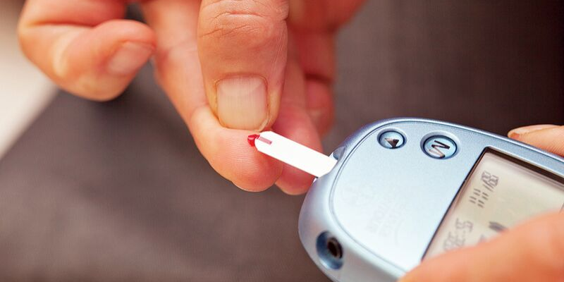 Person checking their blood sugar levels.